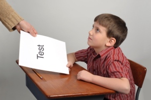 A boy receiving a failing test score